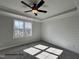 Bright bedroom with large window and shiplap accent wall for a modern touch at 251 Bluejay St, Clayton, NC 27520