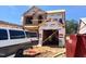 Two-story home under construction with workers installing exterior sheathing at 251 Bluejay St, Clayton, NC 27520
