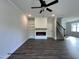 Cozy living room with fireplace, built-in shelves, and modern flooring at 251 Bluejay St, Clayton, NC 27520