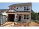 New two-story home featuring a garage and an unfinished yard at 256 Bluejay St, Clayton, NC 27520