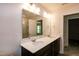 Bright bathroom features a double vanity with a white countertop and modern lighting at 261 White Oak Ridge Dr, Garner, NC 27529