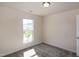 Bright bedroom featuring plush carpeting and a sunny window view at 261 White Oak Ridge Dr, Garner, NC 27529