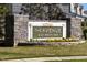 Stone community entrance sign that reads 