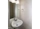 A half bathroom featuring a white sink and a simple, clean design at 261 White Oak Ridge Dr, Garner, NC 27529
