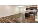 Open living room and kitchen space with wood floors at 261 White Oak Ridge Dr, Garner, NC 27529