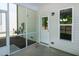 Relax on this screened in patio featuring a back door and sunny windows at 261 White Oak Ridge Dr, Garner, NC 27529