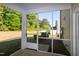 The screened-in porch offers views of green space and abundant sunshine at 261 White Oak Ridge Dr, Garner, NC 27529