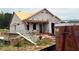 New construction showing the framing stage with red fire hydrant on the front lawn at 262 Bluejay St, Clayton, NC 27520