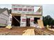 New home under construction, showcasing the framing and Westan Homes housewrap, offering a glimpse into the building process at 263 Bluejay St, Clayton, NC 27520