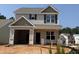 New two-story home with a two-car garage featuring a neutral color scheme at 263 Bluejay St, Clayton, NC 27520
