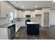 Modern kitchen features granite countertops and stainless steel appliances at 263 Bluejay St, Clayton, NC 27520