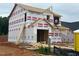 Exterior framing of a new two-story home showing the house wrap and roofline under construction at 268 Bluejay St, Clayton, NC 27520