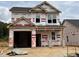 New construction home featuring a two-car garage and traditional architecture at 268 Bluejay St, Clayton, NC 27520