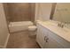 Bright bathroom featuring a tub, toilet, and vanity with modern fixtures and tiling at 3020 Freewinds Way # 47, Cary, NC 27519