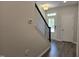 Welcoming entryway with stairs, white door, and durable flooring for a stylish entry at 3020 Freewinds Way # 47, Cary, NC 27519