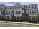 Attractive new townhome exterior with stone accents and manicured landscaping at 3020 Freewinds Way # 47, Cary, NC 27519
