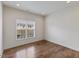 Bright bedroom with a large window and wood floors at 312 Troon Village Ln, Cary, NC 27511