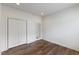 Large bedroom with wood flooring, closet, and lots of space at 312 Troon Village Ln, Cary, NC 27511