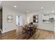 Cozy dining area with round table, seating for four, and views into the kitchen and living spaces at 312 Troon Village Ln, Cary, NC 27511