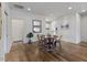 Hardwood floors, recessed lights, and updated decor grace this dining area at 312 Troon Village Ln, Cary, NC 27511