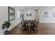 Comfortable dining area next to kitchen offers hardwood floors and soft lighting at 312 Troon Village Ln, Cary, NC 27511