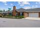 Attractive exterior showcasing a brick facade, attached garage, and neat landscaping for enhanced curb appeal at 312 Troon Village Ln, Cary, NC 27511