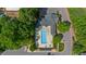 Aerial view of a community pool offering a refreshing escape, complete with lounge chairs and manicured surroundings at 312 Troon Village Ln, Cary, NC 27511