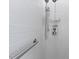 Tile shower featuring a built in shower seat and shower head at 312 Troon Village Ln, Cary, NC 27511
