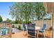 Back deck features a table and four chairs, great for outdoor dining by the fenced in pool at 321 Nortwick Rd, Rolesville, NC 27571