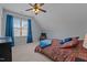 Bedroom with a large window, ceiling fan, and neutral carpet; great for relaxing at 321 Nortwick Rd, Rolesville, NC 27571