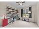 This bedroom boasts industrial style open shelving, a ceiling fan, a large window, and is complete with neutral carpeting at 321 Nortwick Rd, Rolesville, NC 27571