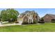 Attractive two-story home featuring a side-entry garage, well-kept lawn, and mature trees at 321 Nortwick Rd, Rolesville, NC 27571