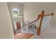 Grand two-story foyer with hardwood floors, chandelier, and a staircase with white spindles at 321 Nortwick Rd, Rolesville, NC 27571