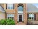 Inviting front entrance with brick detailing, decorative windows, and lush landscaping at 321 Nortwick Rd, Rolesville, NC 27571