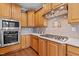 A kitchen with stainless steel appliances, a gas cooktop, and light wood colored cabinets at 321 Nortwick Rd, Rolesville, NC 27571