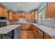 A kitchen with stainless steel appliances, hardwood floors, a kitchen island, and light wood colored cabinets at 321 Nortwick Rd, Rolesville, NC 27571