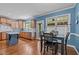 A kitchen with stainless steel appliances, hardwood floors, a kitchen island, and light wood colored cabinets at 321 Nortwick Rd, Rolesville, NC 27571