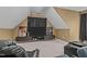 Living area featuring reclining chairs, a media center, and carpeting; a cozy space for relaxation and entertainment at 321 Nortwick Rd, Rolesville, NC 27571