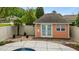 Charming pool house with double doors and a window provides extra space for storage or relaxation at 321 Nortwick Rd, Rolesville, NC 27571