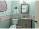 Stylish powder room with decorative tile, modern vanity, and refreshing paint at 321 Nortwick Rd, Rolesville, NC 27571