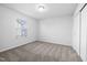 Comfortable bedroom with carpet flooring, closet, and natural light from the window, perfect for relaxation at 3231 Pelican Ln, Durham, NC 27703