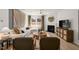 Comfortable living room with fireplace, ample seating and stylish decor and wooden floors at 3231 Pelican Ln, Durham, NC 27703