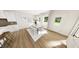 Open dining room area with stylish lighting and a view to the backyard at 334 Beacon Dr, Pittsboro, NC 27312