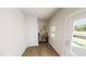 Bright entryway featuring wood flooring, a window, and a console table with decor at 334 Beacon Dr, Pittsboro, NC 27312