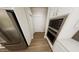Gourmet kitchen featuring stainless steel appliances and white cabinetry at 334 Beacon Dr, Pittsboro, NC 27312
