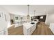 Open concept living space with kitchen, dining area, and living room at 334 Beacon Dr, Pittsboro, NC 27312