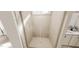 Tiled walk-in shower with glass door and a view into the bathroom at 334 Beacon Dr, Pittsboro, NC 27312