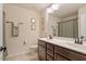 Bright bathroom with double sink vanity, and tile flooring at 3422 Norway Spruce Rd, Raleigh, NC 27616