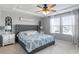 Primary bedroom with a tray ceiling, ceiling fan, and ensuite bathroom at 3422 Norway Spruce Rd, Raleigh, NC 27616