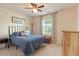 Comfortable bedroom featuring a cozy bed, large window and plenty of natural light at 3422 Norway Spruce Rd, Raleigh, NC 27616